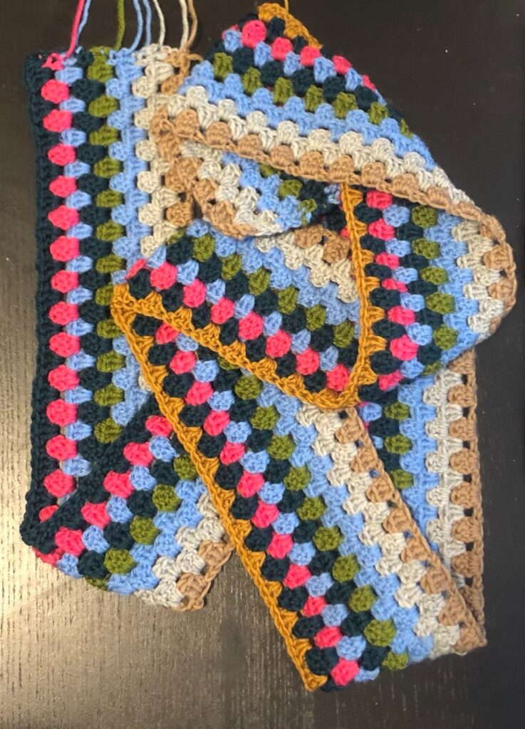 chrochet blanket in progress many colors